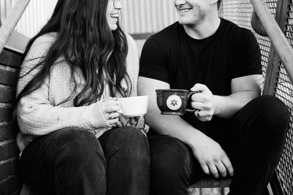 A cup of coffee on a table in a cozy café, symbolizing connection, reflection, and relationship-building.